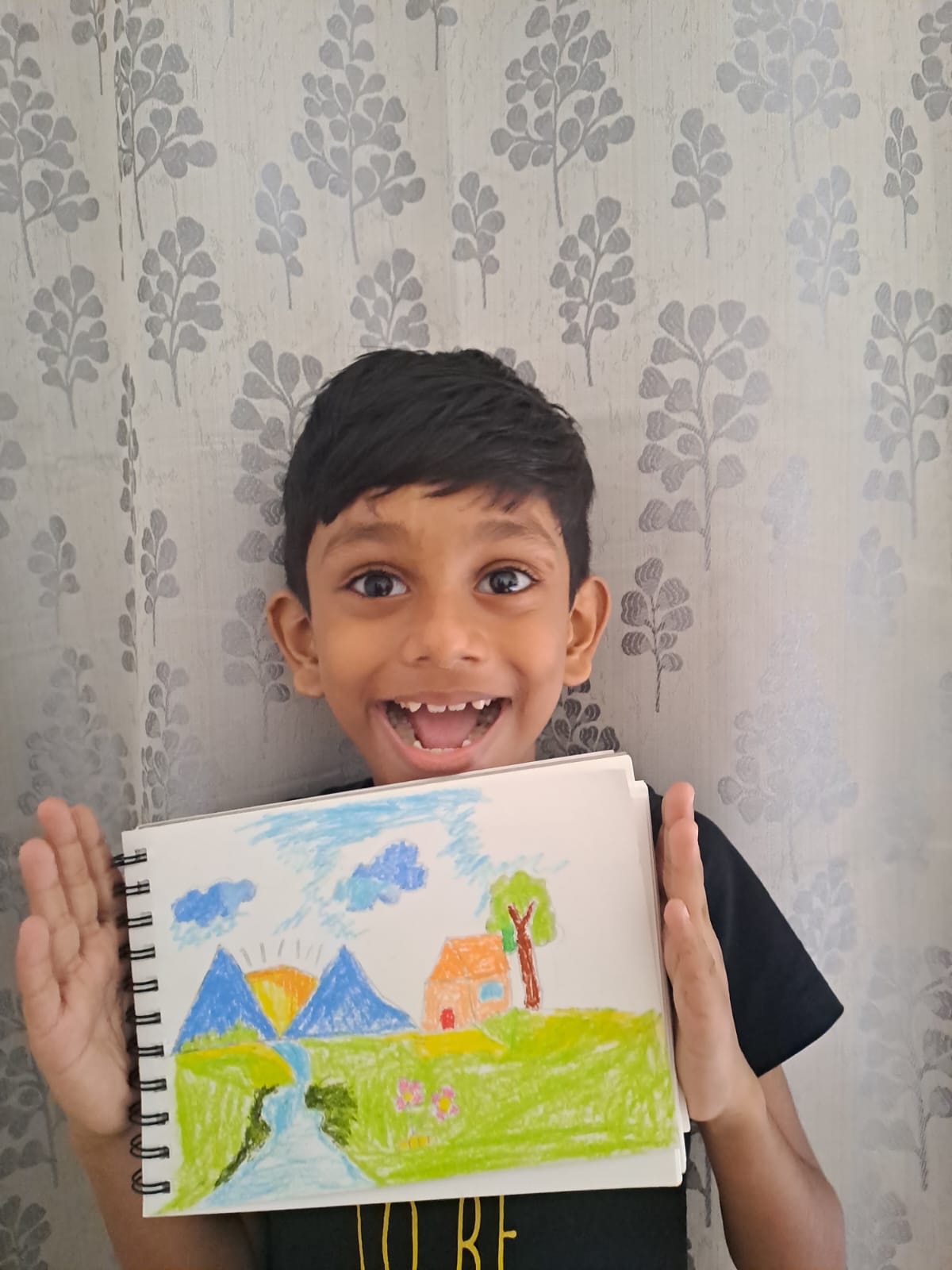 Maram little artist 7 showing their artwork