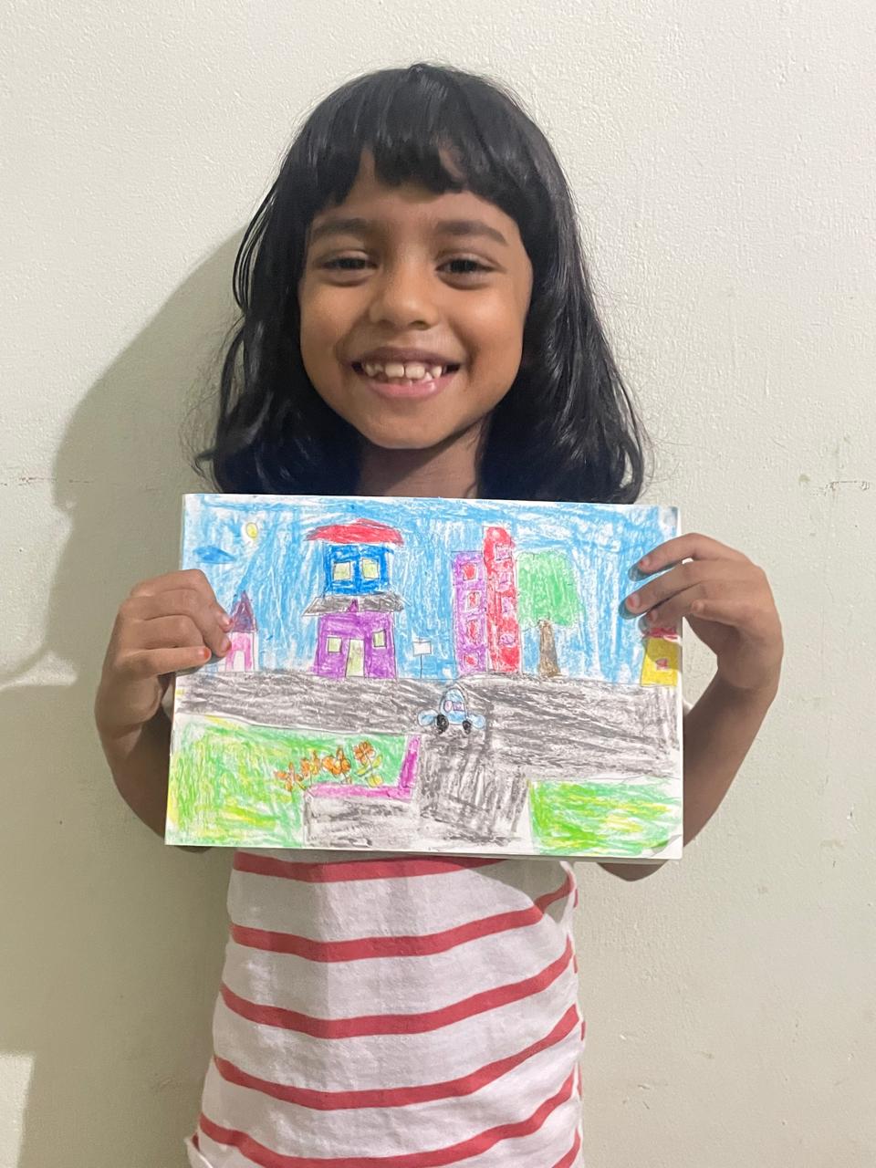 Maram little artist 5 showing their artwork