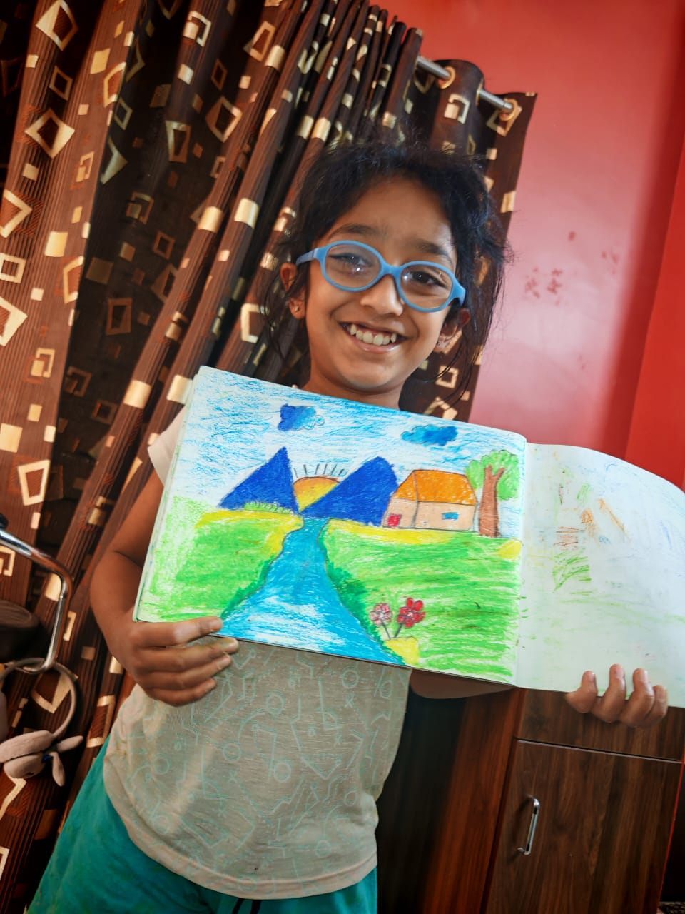 Maram little artist 8 showing their artwork