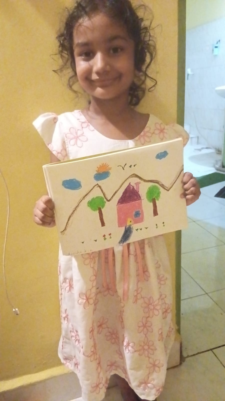 Maram little artist 10 showing their artwork